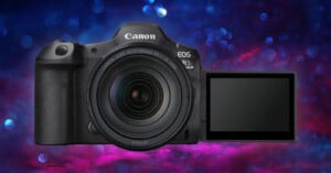 A Canon EOS R5 camera with an RF 24-105mm lens is shown against a vibrant, colorful background of blue and pink hues. The camera's LCD screen is extended and facing forward.