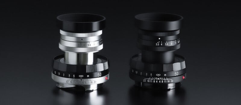 Two vintage-style camera lenses are shown against a dark background. One lens has a silver and black design, while the other is fully black. Both lenses have a manual focus ring with visible aperture and distance markings.