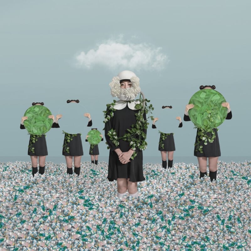 Six figures in uniform black dresses stand in a sea of crumpled cans. The central figure is adorned with green leaves and wears a white headpiece with a beard. The surrounding figures hold circular green shapes with cut-out eye shapes, obscuring their faces.