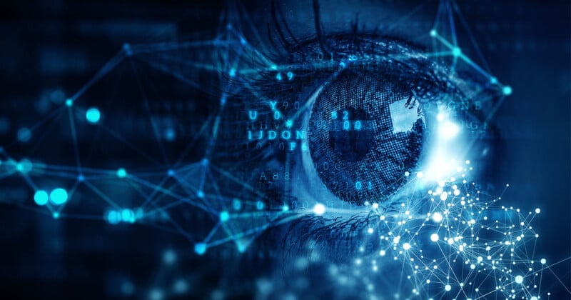 A close-up of a human eye surrounded by digital and futuristic elements such as interconnected lines and nodes. The image is bathed in blue tones, giving it a technological and sci-fi appearance, suggesting themes of surveillance, artificial intelligence, or cyber technology.