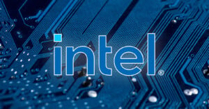 The image shows the Intel logo written in lowercase white letters with a blue background. The logo is overlaid on a close-up of a blue computer motherboard with intricate circuit patterns.