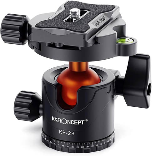 A black K&F Concept KF-28 tripod ball head with a quick-release plate and adjustment knobs. The ball head has a red interior component and a bubble level indicator on the side. The entire device is made for camera mounting and positioning.