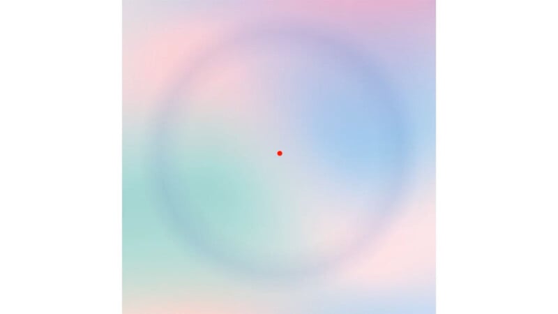 A soft pastel gradient background with shades of pink, blue, and purple. In the center, there is a small red dot surrounded by a faint, large circular gradient. The overall appearance is calm and abstract.