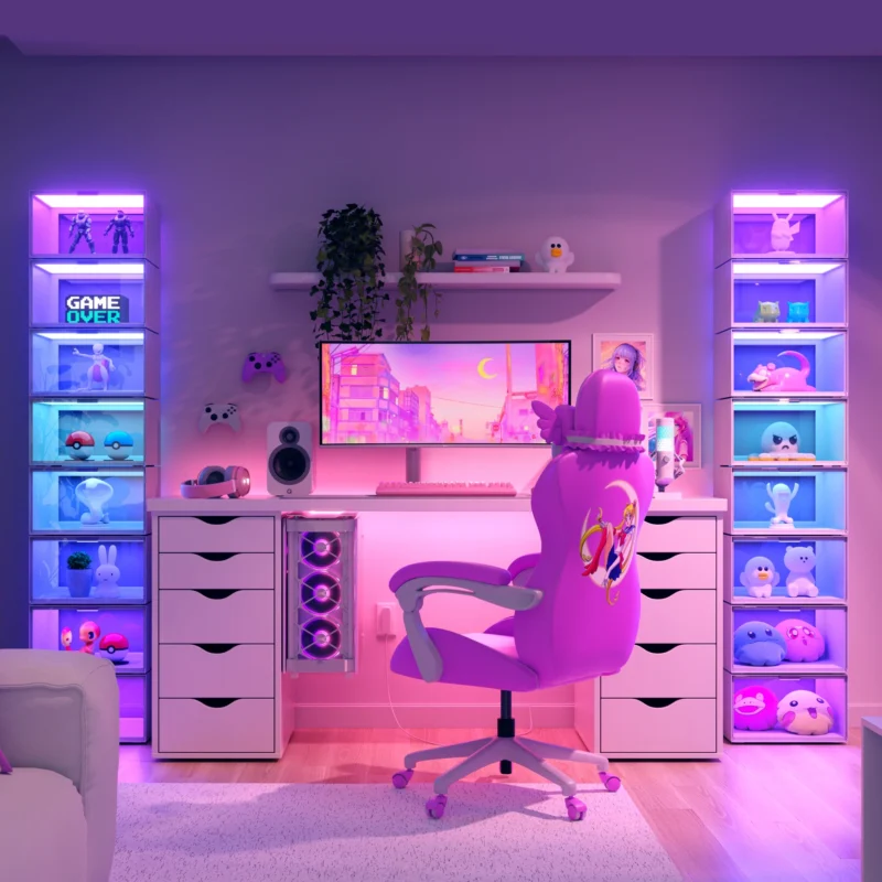 A cozy gaming setup with a pink and purple theme. A pink gaming chair is in front of a desk with a large monitor displaying a colorful cityscape. Shelves on both sides are lit with neon lights and filled with various gaming collectibles and plush toys.