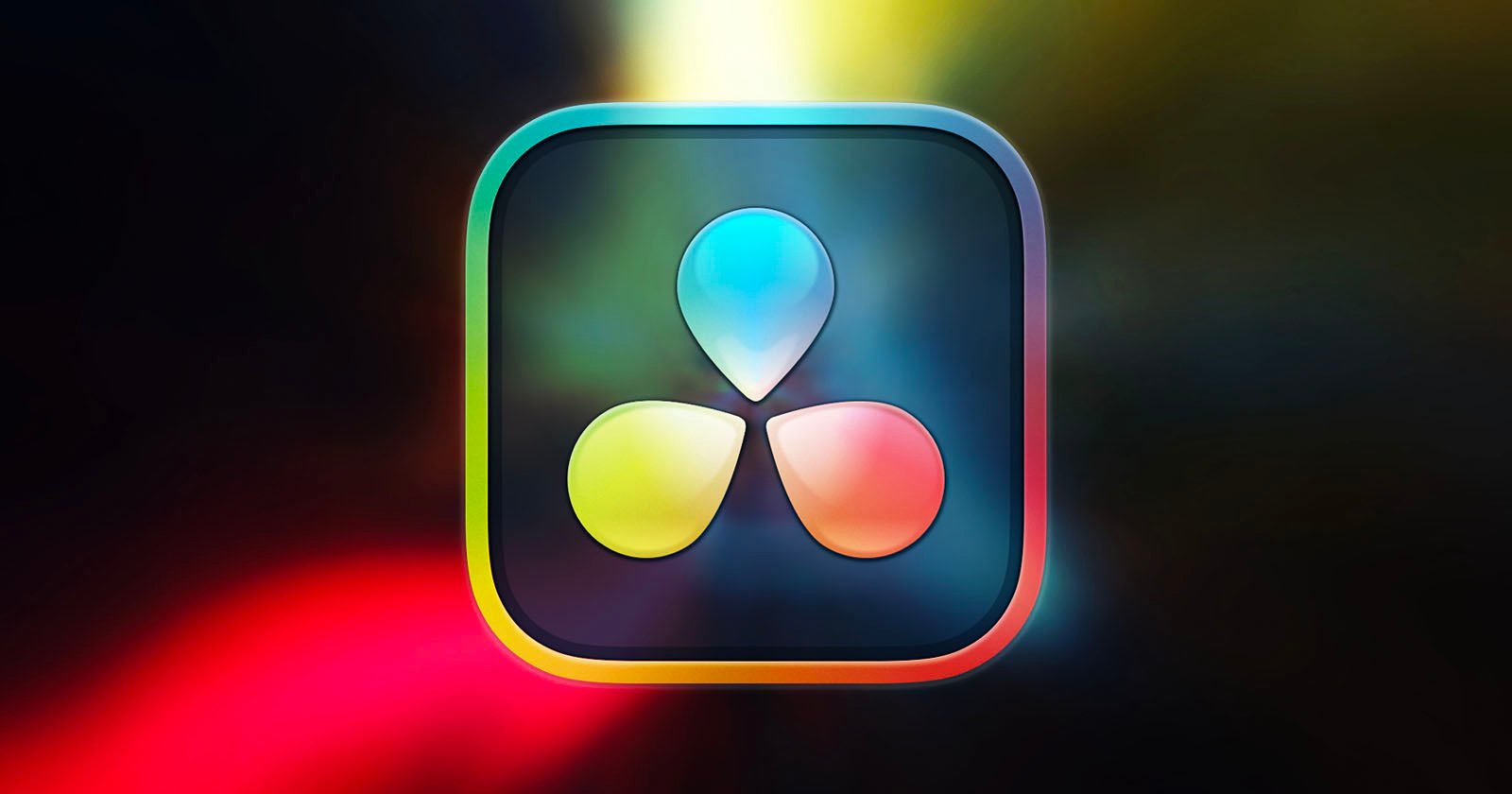 The image shows the DaVinci Resolve logo, which features a rounded square with a dark background and three colorful, teardrop-like shapes in the center, arranged in a triangular pattern. The shapes are blue, yellow, and red, against a blurred, multicolored background.