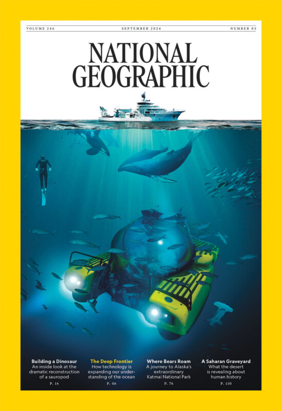 A National Geographic magazine cover shows a submarine underwater. 