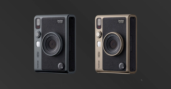 An image showing two Fujifilm Instax Mini Evo instant cameras against a dark background. The cameras feature a retro design with a prominent lens in the center, and are available in two colors: black and beige. Both cameras have a textured grip and various control buttons.