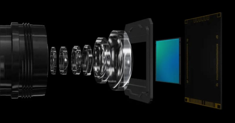 A cutaway graphic of a camera lens assembly. Various lens elements are shown in sequence from left to right, illustrating the internal components. At the end of the lens array is a blue-green sensor chip, emphasizing the imaging sensor.