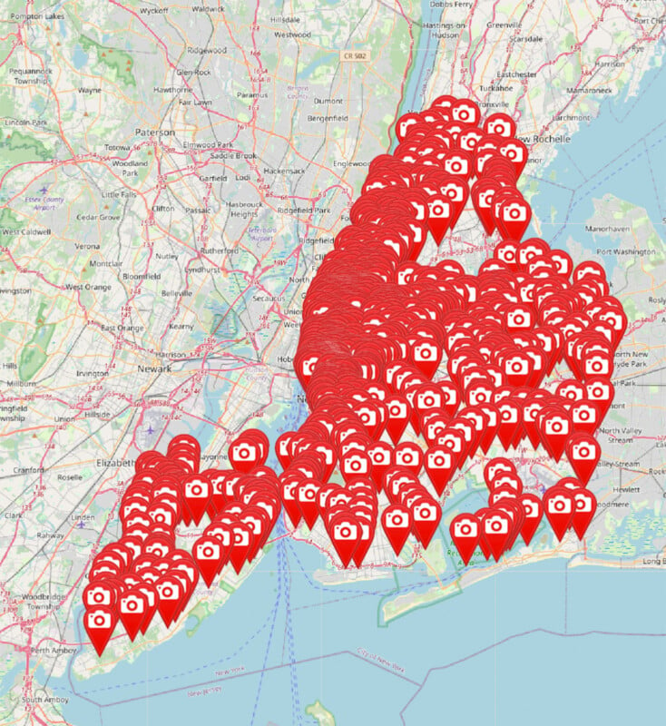 A detailed map highlights New York City and surrounding areas, marked densely with red location pins featuring camera icons. The cluster of pins indicates numerous photo spots or points of interest across the city and adjacent regions.