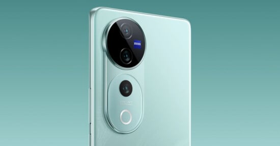 Close-up of the back of a modern smartphone with a sleek design, featuring three camera lenses arranged in a vertical module. The smartphone body is a light mint color, and the background is a gradient of teal shades.