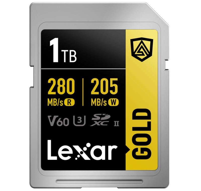 Image of a Lexar GOLD 1TB SDXC memory card with read speeds of 280 MB/s and write speeds of 205 MB/s, featuring V60, UHS-II, and U3 ratings. The card has a black and yellow color scheme with the Lexar logo and a shield icon in the top right corner.