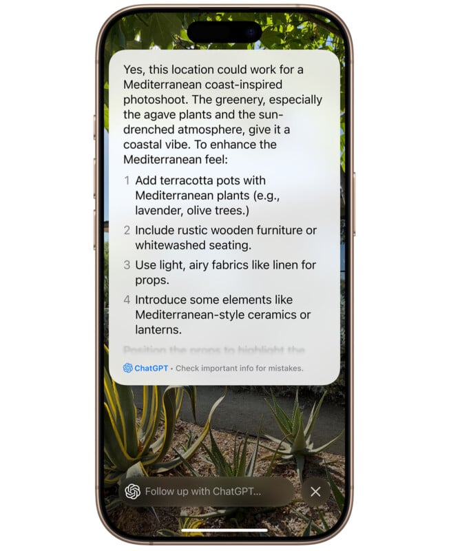 A smartphone screen displaying a message from ChatGPT. The message suggests elements for a Mediterranean-themed photoshoot, such as terracotta pots, rustic furniture, airy fabrics, and Mediterranean ceramics or lanterns. The background shows lush greenery and plants.