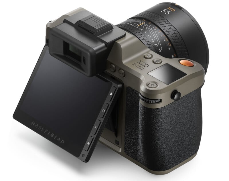 A medium format camera features an olive green and black body with a digital display that is tiltable. The lens is marked "55" and has detailed focus and zoom settings. The camera has a viewfinder and several control buttons for adjusting settings.