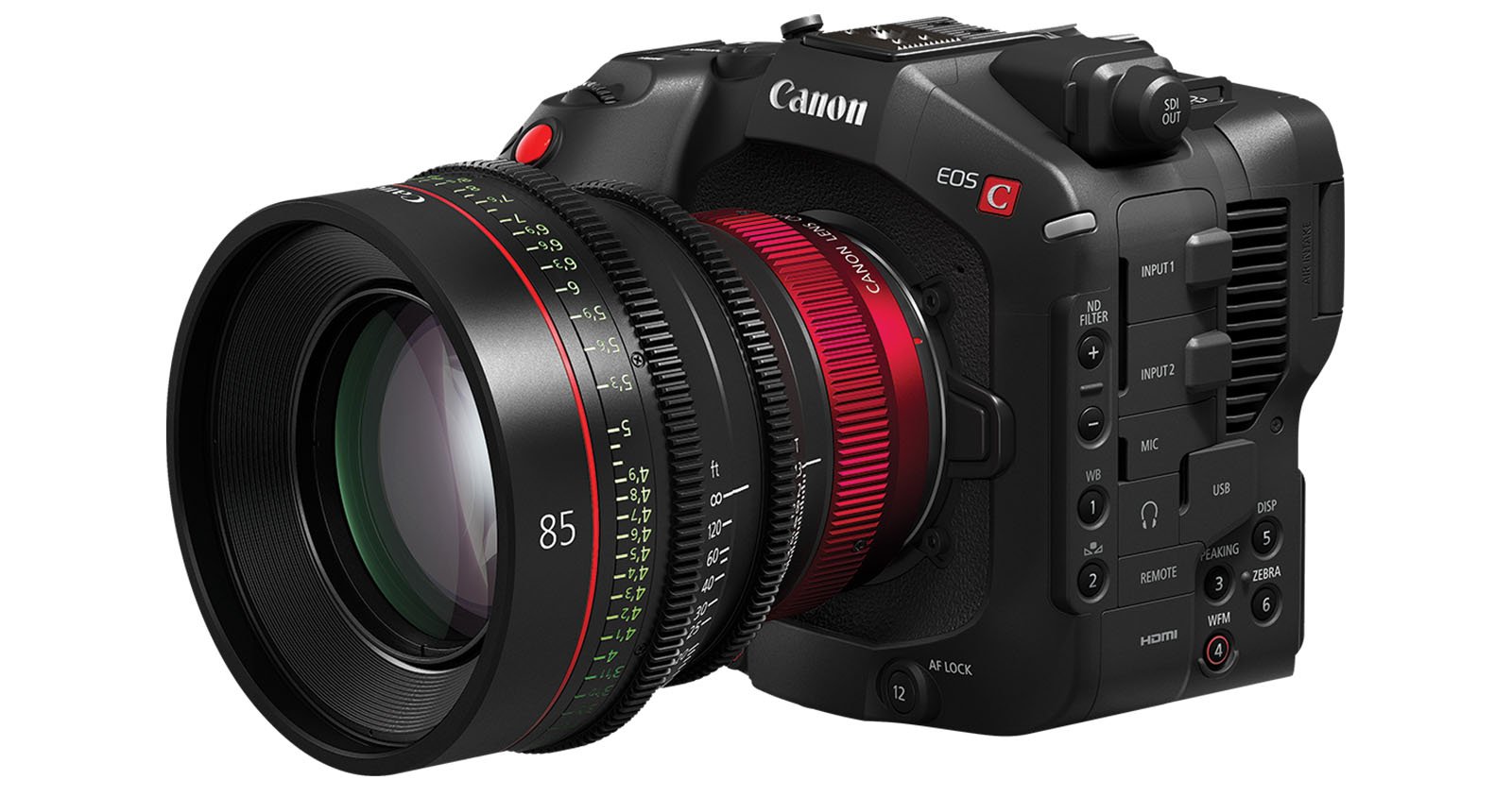 A Canon EOS C cinema camera with a large 85mm lens attached. The camera is black with numerous buttons and dials on its side. The lens has red accents and measurements marked in green and white.