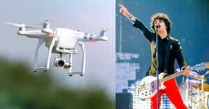 On the left, a drone is flying in the sky with a camera attached below. On the right, a musician with curly hair and casual attire points upwards with their right hand while holding a white guitar, performing energetically on stage.