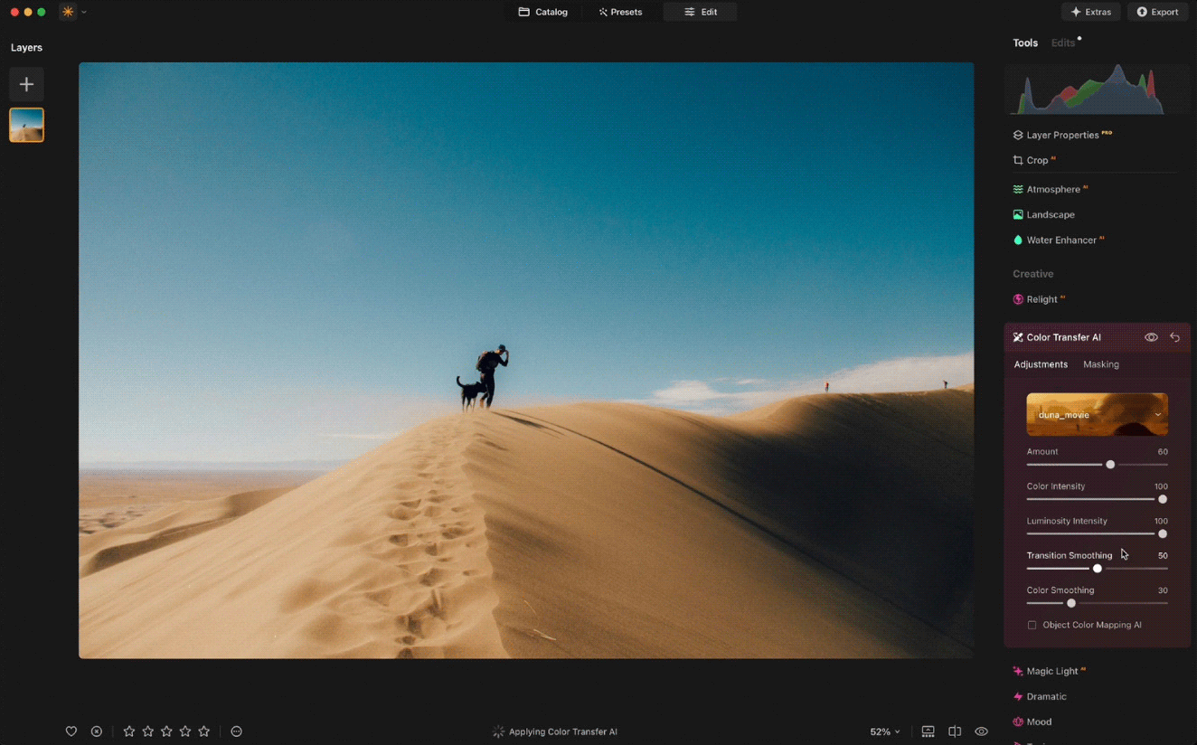 A photo editing software interface is shown. A picture of a person standing on a sand dune, possibly holding a camera, is being edited. Various adjustment tools and settings such as crop, color transfer, and luminescence are visible on the right side of the screen.