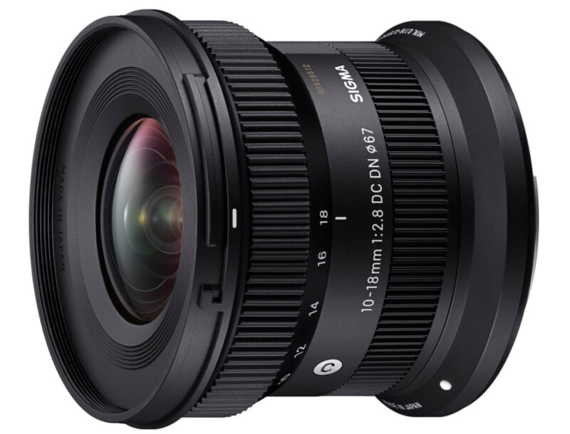 A wide-angle Sigma lens with a focal length of 10-18mm and a maximum aperture of f/2.8. The lens has a black finish with silver details and various adjustment rings. The model is marked as "10-18mm 1:2.8 DC DN 67" and features the Sigma logo.