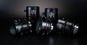 A group of four camera lenses by Sirui are displayed against a dark background. The lenses are labeled with various specifications: 15mm, 35mm, 50mm, and 100mm. They feature a sleek black design with blue accents and white, orange text detailing their specs.