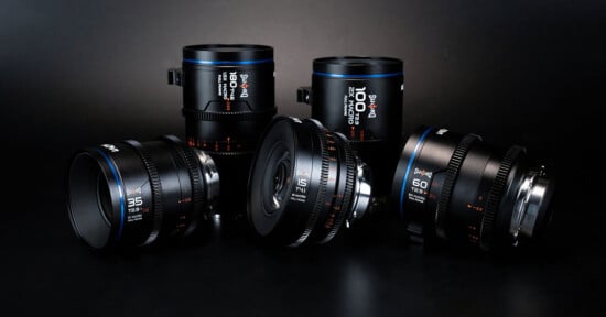 A group of four camera lenses by Sirui are displayed against a dark background. The lenses are labeled with various specifications: 15mm, 35mm, 50mm, and 100mm. They feature a sleek black design with blue accents and white, orange text detailing their specs.