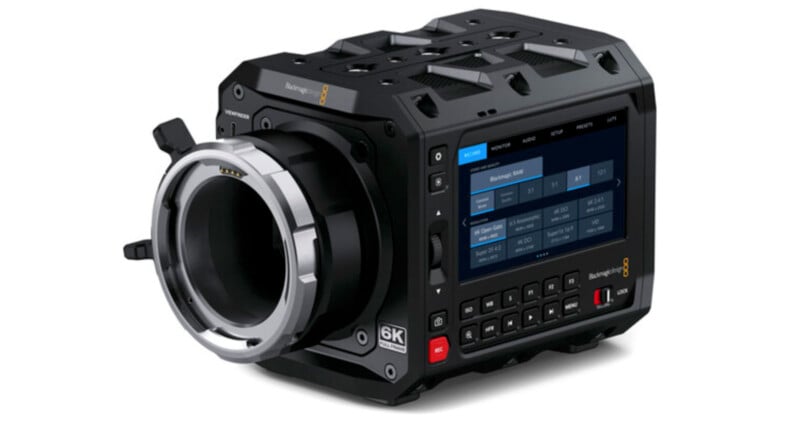 A high-definition Blackmagic 6K digital cinema camera featuring a robust body with a lens mount on the front and a touch screen interface on the side displaying various control settings.