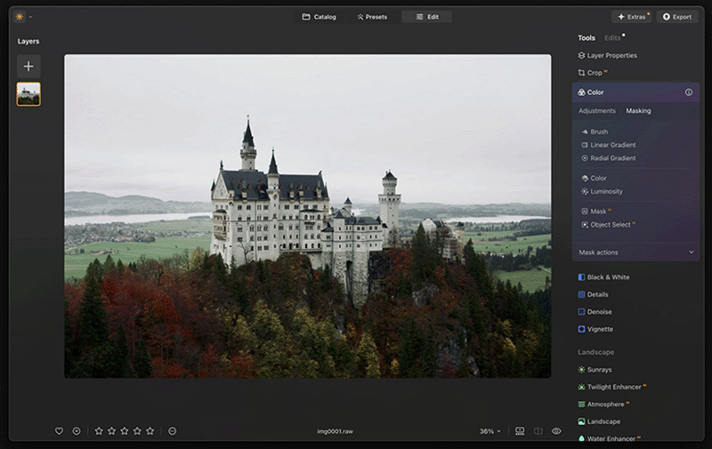 A computer screen displays a photo editing application. The main image is of a castle on a hill surrounded by trees with autumn foliage. The app interface shows various editing tools and options on the right side, including adjustments for color, masking, and others.