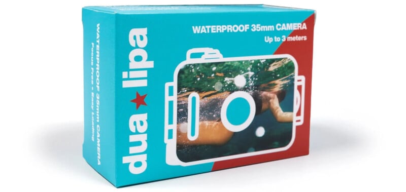 A product box for a waterproof 35mm camera featuring a submerged person’s hands in water. The box has a blue and red design with white text that reads "dua lipa" and "WATERPROOF 35mm CAMERA Up to 3 meters.