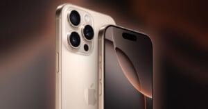 A close-up view of a gold-colored smartphone with three camera lenses on the back and a sleek, minimalistic design. The screen is off, with a black display and a small notch at the top for the front camera. The Apple logo is visible on the back of the device.