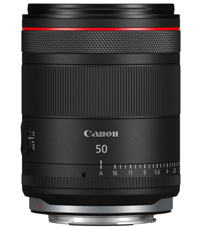 A black Canon camera lens with a red ring near the top edge. The lens has "Canon" and "50" written on it, along with an autofocus/manual focus switch on the side and aperture markings at the base.