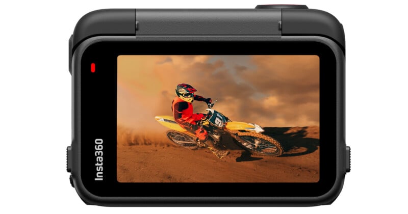 A sports camera screen displaying a person riding a motorcycle across a sandy terrain. The rider is dressed in red and black gear, wearing a helmet, as clouds of dust rise behind. The camera model is Insta360.