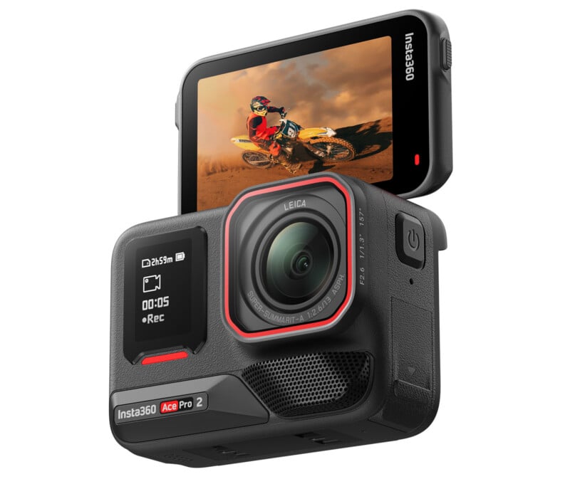 A compact Insta360 action camera with a large lens and a flip-up touchscreen display showing a motocross rider. The screen shows recording details, and the camera body features branding and controls.