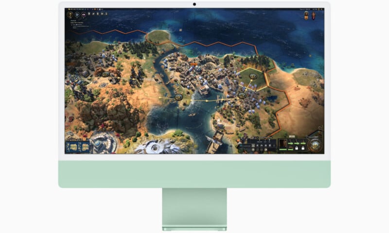 A stylish desktop computer displaying a strategy video game with a hexagonal grid map. The screen shows various terrain types, cities, and water bodies. The computer has a sleek, modern design with a light green base.