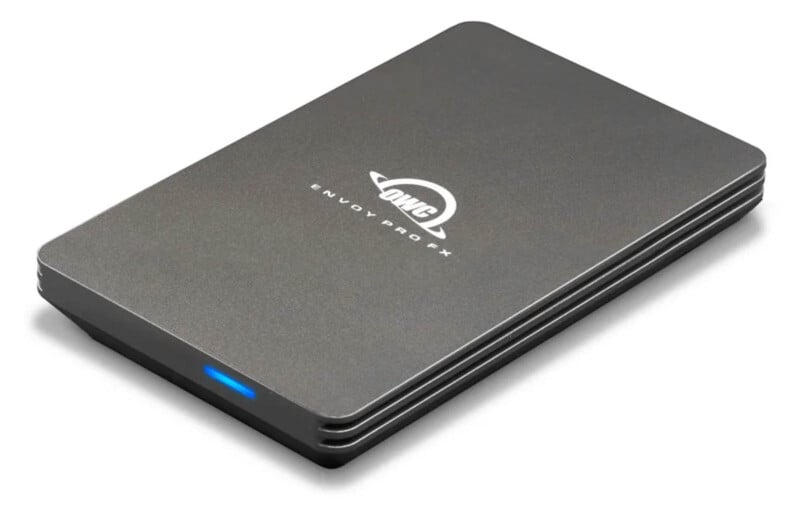 External hard drive with a sleek, gray metallic design and rounded edges. It has the "OWC Envoy Pro X" logo on top and a small blue LED indicator on the side.