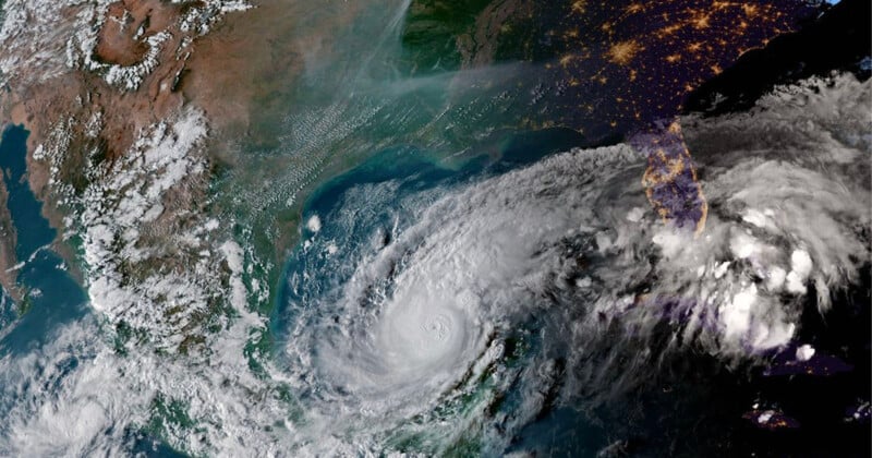 Satellite image showing a large swirling hurricane in the Gulf of Mexico, with cloud coverage extending over the southeastern United States. Nighttime city lights are visible in Florida and along the eastern seaboard.