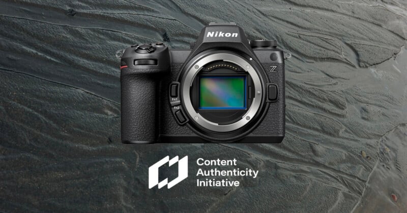 A Nikon Z series camera displayed without a lens against a textured background. The logo for the Content Authenticity Initiative appears below the camera.