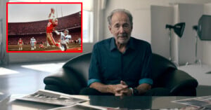 An older man sits on a black couch, surrounded by photographs. Inset: a football player leaps to catch a pass in a crowded stadium.