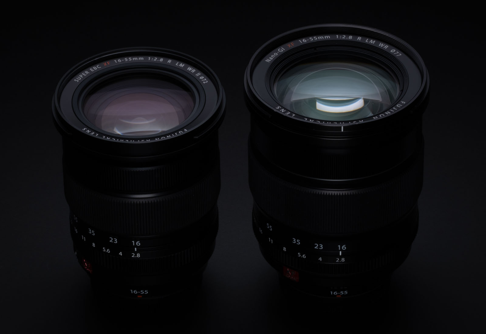 Two camera lenses on a black background. The lens on the left is a 16-55mm f/2.8 zoom lens, and the one on the right is a 56mm f/1.2 prime lens. Both have visible glass elements and numerical markings on the barrels.