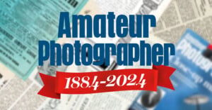 Text reading "Amateur Photographer 1884-2024" in blue and white with a red ribbon. Background features vintage magazine clippings and photography-related graphics.