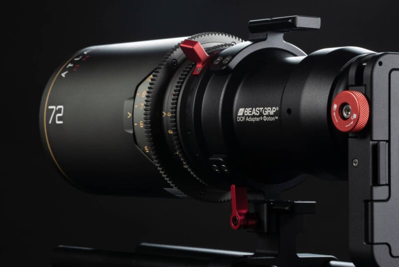 A close-up of a professional camera lens with "Beastgrip DOF Adapter" branding. The lens features red accents, a focus ring with gear teeth, and the number 72 visible, set against a dark background.