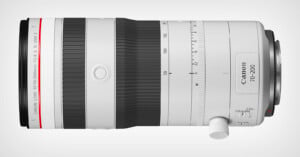 A white Canon RF 70-200mm f/2.8 L IS USM telephoto lens with zoom and focus rings, a white tripod collar, and a silver mount, set against a light gray background.