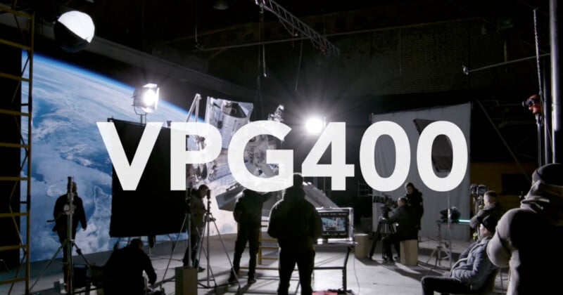 A film set with crew members, lighting equipment, and cameras is centered around a space-themed backdrop. The bold text "VPG400" is superimposed across the image.