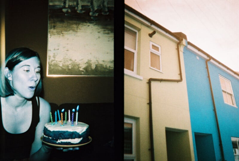 A woman blows out candles on a cake inside a dimly lit room, while the adjacent image shows a bright blue and yellow row of houses under a clear sky.