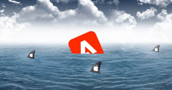 An abstract image depicting a red and white letter "A" logo partially submerged in the ocean, surrounded by several shark fins with Apple logos. The sky is cloudy, creating a dramatic atmosphere.