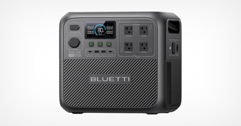 A gray Bluetti portable power station with multiple sockets, an LED display showing "80," and various control buttons. The sleek design features a textured lower half and includes USB ports on the side.