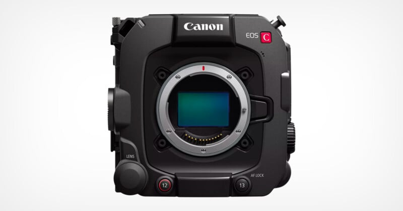 Front view of a Canon EOS C camera, featuring a square black body with prominent control buttons and an exposed sensor area. The design includes various dials and ports, emphasizing its professional and technical features.