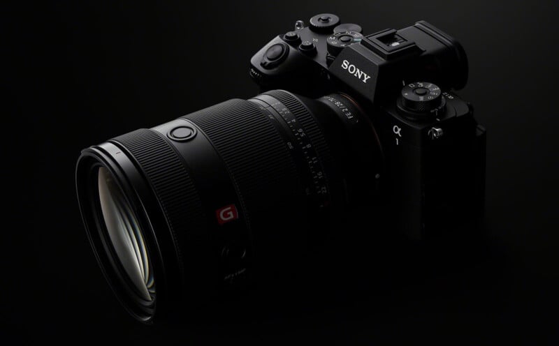 A sleek, black Sony α1 camera with an attached G Master lens is showcased against a dark background, highlighting its professional design and advanced features.