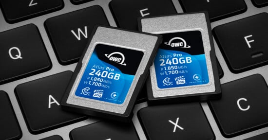 Two OWC Atlas Pro 240GB memory cards are placed on a keyboard. The cards display read speeds of 1,850 MB/s and write speeds of 1,700 MB/s, with CF and VPG 200 ratings.