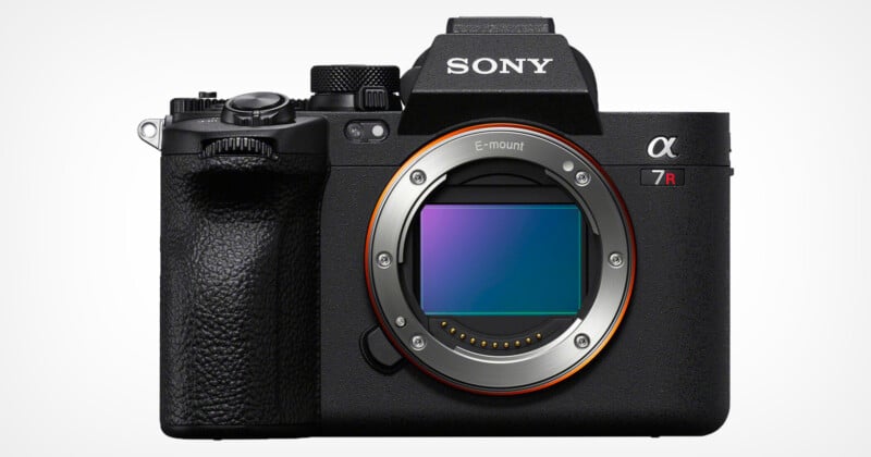 A black Sony Alpha 7R IV mirrorless camera with an exposed E-mount sensor, featuring a textured grip and a large electronic viewfinder housing, displayed against a plain white background.