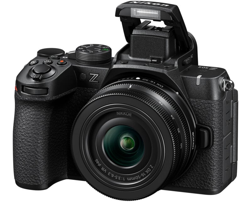 A Nikon Z camera with a black body and a NIKKOR Z DX 16-50mm lens is shown. The camera's electronic viewfinder is flipped up, and various buttons and dials are visible. The lens is prominently featured at the front.