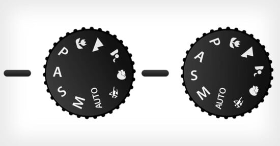 Image of two black camera mode dials. Each dial includes settings like "P," "A," "S," "M," and "AUTO," along with icons for portrait, landscape, macro, and sports modes. The dials are against a light gray background.