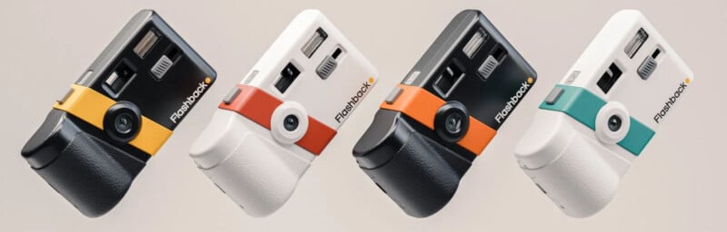 Four retro-style cameras are displayed in various colors: black with yellow, black with orange, white with orange, and white with teal. Each camera features a flash, viewfinder, and grip, showcasing a vintage aesthetic.